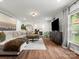 Spacious living room with hardwood floors and neutral colors at 1102 Oak Hill Dr, Monroe, NC 28112