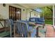Cozy screened patio with stylish seating and a view of the lush backyard, perfect for relaxing and entertaining at 1102 Oak Hill Dr, Monroe, NC 28112