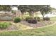Inviting community entrance with stone pillars, lush landscaping, and a serene fountain at 1215 Coppergate Dr, Salisbury, NC 28147