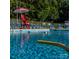 Community pool features clear, sparkling water and plenty of lounge chairs on a bright day at 1215 Coppergate Dr, Salisbury, NC 28147