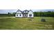 A newly constructed home with modern farmhouse design, set in a spacious landscaped yard at 1215 Coppergate Dr, Salisbury, NC 28147
