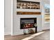 Cozy living room featuring a modern fireplace with a decorative mantel and ample natural light at 1215 Coppergate Dr, Salisbury, NC 28147