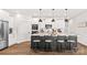 Modern kitchen with an island, stylish seating, white cabinets, and stainless steel appliances at 1215 Coppergate Dr, Salisbury, NC 28147