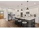 Modern kitchen with white cabinets, center island, stainless steel appliances, and hardwood floors at 1215 Coppergate Dr, Salisbury, NC 28147