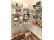 Organized pantry featuring wire shelving and various containers for optimal storage and accessibility at 1215 Coppergate Dr, Salisbury, NC 28147