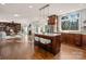 Bright kitchen with central island, stainless appliances, wood cabinets and breakfast nook open to living space at 13101 Whisper Creek Dr, Charlotte, NC 28277
