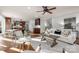 Open-concept living room flows into the kitchen, featuring a cozy seating area, a decorative rug, and modern decor at 13101 Whisper Creek Dr, Charlotte, NC 28277