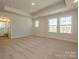 Spacious bedroom with plush carpeting, neutral walls, recessed lights, and bright natural light at 165 Halite Ln, Waxhaw, NC 28173