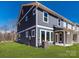 View of home's gray exterior, green lawn, and bright-white trim at 165 Halite Ln, Waxhaw, NC 28173