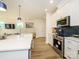 Well-appointed kitchen showcasing a center island, stainless steel appliances, and modern finishes at 165 Halite Ln, Waxhaw, NC 28173