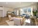 Bright living room featuring modern furniture, hardwood floors, and large windows showcasing the outdoor view at 165 Halite Ln, Waxhaw, NC 28173