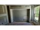 Unfinished bedroom with a window and built-in shelving at 18514 Victoria Bay Dr, Cornelius, NC 28031