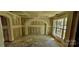 Unfinished dining room with an arched alcove and large window at 18514 Victoria Bay Dr, Cornelius, NC 28031