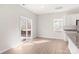 A view of the dining area that features access to the kitchen and a sliding glass door with wooded views at 3250 Maple Ridge Dr, Gastonia, NC 28052