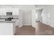 Open kitchen featuring stainless steel appliances, granite countertops, and direct access to the staircase at 3250 Maple Ridge Dr, Gastonia, NC 28052