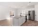 Bright kitchen featuring stainless steel appliances, granite countertops, and an island at 3250 Maple Ridge Dr, Gastonia, NC 28052