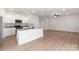 Open-concept kitchen with granite countertops, island, and stainless steel appliances at 3250 Maple Ridge Dr, Gastonia, NC 28052