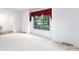 Bright living room featuring large windows with decorative curtains and neutral carpet flooring at 829 Rawlinson Rd, Rock Hill, SC 29732