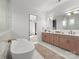 Spa-like bathroom with a soaking tub and double sink vanity at 1015 Kendall Dr # 4, Wesley Chapel, NC 28173