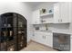 Butler's pantry area features white cabinets, tiled backsplash, and modern fixtures at 1015 Kendall Dr # 4, Wesley Chapel, NC 28173