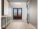 Welcoming foyer featuring double doors, a modern chandelier, and light wood flooring at 1015 Kendall Dr # 4, Wesley Chapel, NC 28173