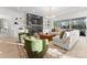 Bright living room featuring large windows, a cozy fireplace, and modern furniture at 1015 Kendall Dr # 4, Wesley Chapel, NC 28173