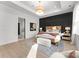 Well lit main bedroom showcasing wood trim detail, and adjoining ensuite at 1015 Kendall Dr # 4, Wesley Chapel, NC 28173