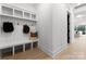 Mudroom with built-in storage bench and shelves perfect for organization at 1015 Kendall Dr # 4, Wesley Chapel, NC 28173