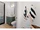 Stylish powder room with olive green vanity and eye-catching striped towels at 1015 Kendall Dr # 4, Wesley Chapel, NC 28173