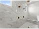 Luxurious walk-in shower featuring marble-style tile and multiple shower heads at 1015 Kendall Dr # 4, Wesley Chapel, NC 28173