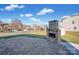 Landscaped backyard with firepit and storage shed at 10436 Paisley Abbey Ln, Charlotte, NC 28273