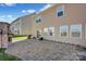 Brick patio with fire pit and neighbor's houses in view at 10436 Paisley Abbey Ln, Charlotte, NC 28273