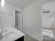 Bathroom with double vanity, dark cabinets, and a shower/tub combo at 10436 Paisley Abbey Ln, Charlotte, NC 28273