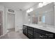 Bathroom with double vanity and large mirror at 10436 Paisley Abbey Ln, Charlotte, NC 28273