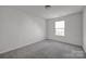 Simple bedroom with window and ceiling light at 10436 Paisley Abbey Ln, Charlotte, NC 28273