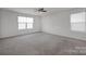 Bright bedroom with carpet flooring and ceiling fan at 10436 Paisley Abbey Ln, Charlotte, NC 28273