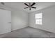 Bright bedroom with ceiling fan, window, and carpet at 10436 Paisley Abbey Ln, Charlotte, NC 28273