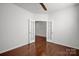 Bright bedroom with hardwood floors and double french doors at 10436 Paisley Abbey Ln, Charlotte, NC 28273