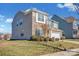 Two-story house with stone and siding accents, two-car garage, and landscaped lawn at 10436 Paisley Abbey Ln, Charlotte, NC 28273