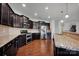 Modern kitchen with stainless steel appliances and granite countertops at 10436 Paisley Abbey Ln, Charlotte, NC 28273