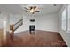 Bright living room with hardwood floors, fireplace and stairway at 10436 Paisley Abbey Ln, Charlotte, NC 28273