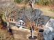 An aerial shot showcasing a ranch-style brick home with a spacious front yard at 131 Nantz Ave, Mount Holly, NC 28120