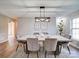 Modern dining room with large table and six chairs, hardwood floor at 131 Nantz Ave, Mount Holly, NC 28120