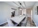 Modern dining room with concrete table and grey velvet chairs at 131 Nantz Ave, Mount Holly, NC 28120