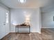 Bright entryway with shiplap accent wall and wood-look flooring at 131 Nantz Ave, Mount Holly, NC 28120