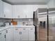 White kitchen cabinets and stainless steel appliances at 131 Nantz Ave, Mount Holly, NC 28120