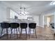 Kitchen with island and four barstools at 131 Nantz Ave, Mount Holly, NC 28120