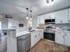 Modern kitchen featuring stainless steel appliances and white shaker cabinets at 131 Nantz Ave, Mount Holly, NC 28120