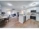 Open concept kitchen boasting white cabinets and stainless steel appliances at 131 Nantz Ave, Mount Holly, NC 28120