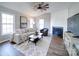 Bright living room featuring hardwood floors and a cozy fireplace at 131 Nantz Ave, Mount Holly, NC 28120